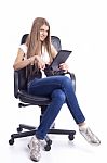 Woman With Tablet Computer In Office Chair Stock Photo