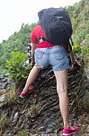 Women Climbing The Mountain Stock Photo