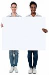 Women Displaying Blank Whiteboard Stock Photo