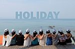 Women Friends Sit Hug Together Look Holiday Sea Sky Stock Photo