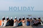 Women Friends Sit Hug Together Look Holiday Sea Sky Stock Photo