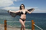 Women On Beach In Black Bikini Stock Photo