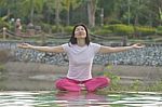 Women Practices Yoga Stock Photo