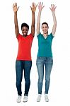 Women Raising Their Arms Up In Excitement Stock Photo