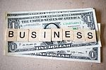 Wooden Block Word Business And Dollar Banknote Stock Photo