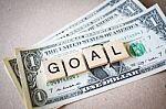 Wooden Block Word Goal And Dollar Banknote Stock Photo