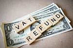 Wooden Block Word Vat Refund And Dollar Banknote Stock Photo