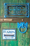 Wooden Door With A Slot Mailbox And The Word In Spanish Means "b Stock Photo