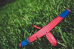 Wooden Glider Lying In Grass Broken Stock Photo