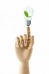 Wooden Hand And Bulb Stock Photo