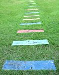 Wooden Piece Color Path Walk On Green Field Stock Photo