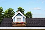 Wooden Window With Flower At The Roof Of The House Stock Photo