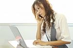 Working Girl At Some Light Office On Business Hour Stock Photo