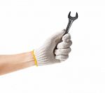 Working Hand In Glove Holding Wrench Stock Photo