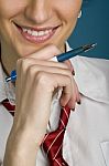 Working Woman Thinking With A Pen In Hand Stock Photo