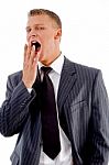 Yawning Young Businessman Stock Photo