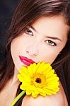 Yellow Daisy On Woman's Shoulder Stock Photo