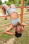 Young African Woman Doing Sit-ups Stock Photo