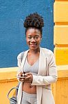 Young African Woman With A Smartphone Stock Photo