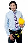 Young Architect Holding Hard Hat Stock Photo