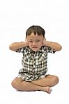 Young Asian Boy Closing Ears Stock Photo