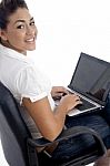 Young Beautiful Female Working On Laptop Stock Photo