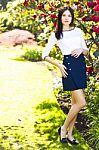 Young Beautiful Tall Woman With Long Straight Dark Hair Posing A Stock Photo