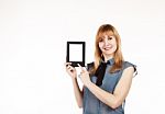 Young Beautiful Woman Holding A Tablet Stock Photo