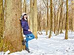 Young Beautiful Woman In The Woods In Winter Stock Photo