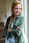 Young Beautiful Woman Moving In A New Home Stock Photo