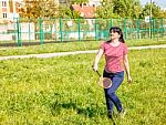 Young Beautiful Woman Playing Badminton Stock Photo