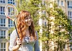 Young Beautiful Woman Playing Badminton Stock Photo