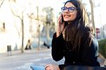 Young Beautiful Woman Using Her Mobile Phone In The Street Stock Photo