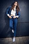 Young Beautiful Woman With Denim Suit Stock Photo