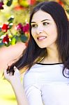 Young Beautiful Woman With Long Straight Dark Hair Posing In Gar Stock Photo