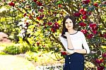 Young Beautiful Woman With Long Straight Dark Hair Posing In Spr Stock Photo