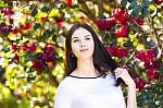 Young Beautiful Woman With Long Straight Dark Hair Posing In Spr Stock Photo