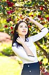 Young Beautiful Woman With Long Straight Dark Hair Posing In Spr Stock Photo