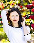 Young Beautiful Woman With Long Straight Dark Hair Posing In Spr Stock Photo