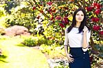 Young Beautiful Woman With Long Straight Dark Hair Posing In Spr Stock Photo