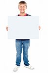 Young Boy Holding Blank Board Stock Photo