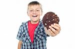 Young Boy Holding Chocolate Cookie Stock Photo