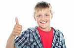 Young Boy Showing Thumbs Up Stock Photo