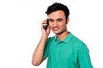 Young Boy Speaking Over Cellphone Stock Photo