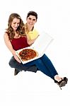 Young Boy Surprises Girlfriend With Pizza Stock Photo