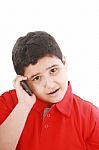 Young Boy Talking To Cell Phone Stock Photo