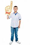 Young Boy Wearing Foam Hand Stock Photo