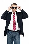 Young Business Achiever Holding Shades In Style Stock Photo