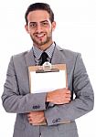 Young Business Man Holding A Clip Board Stock Photo