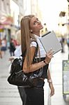 Young Business Woman With Tablet Computer Walking On Urban Stree Stock Photo